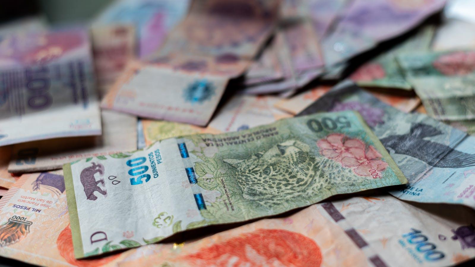 Argentine peso banknotes — the currency at the heart of Milei's monetary regime.