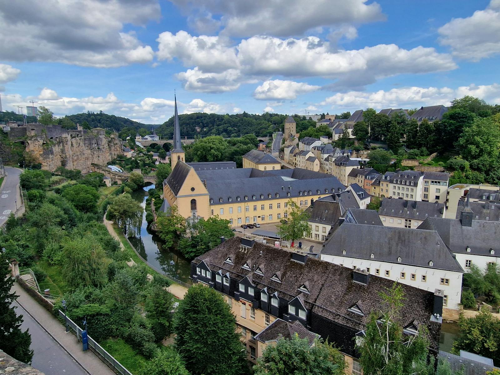 Panoramic view of Luxembourg City along the Alzette river by Neumünster Abbey.