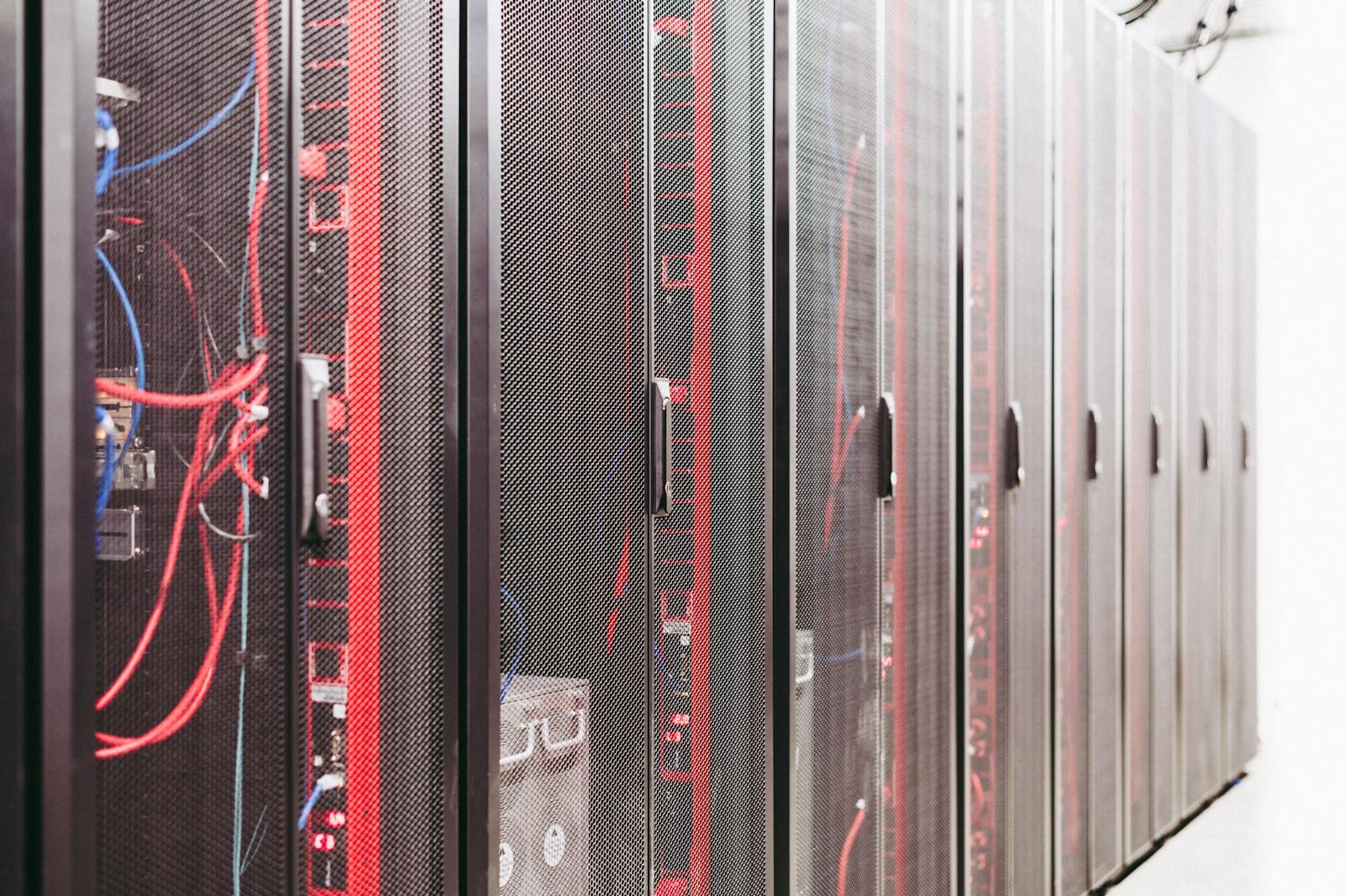 Rows of data-centre server racks with bundled cabling.
