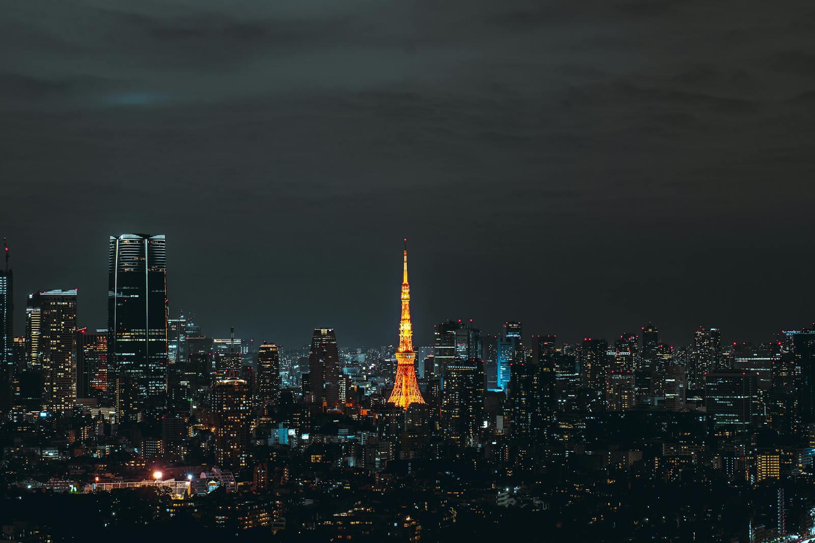 Tokyo skyline at night with the illuminated Tokyo Tower.