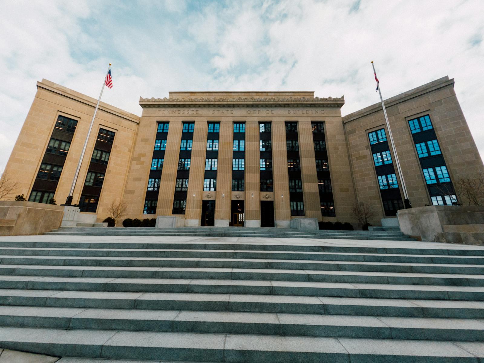 Marriner S. Eccles Federal Reserve building in Washington with US flags.